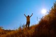 young man raising his hands