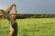 young woman with scarf in a field