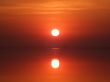 Red sunset above a serene gulf