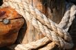 Rope, nail and wooden surface
