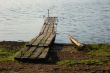 An old planked footway by the river in north Russia