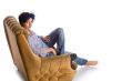 woman sitting in armchair