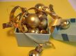 Open blue gift box with golden balls