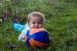 Timid baby with ball