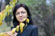 young woman with black hair in glasses, autumn shot