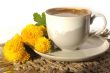 A cup of coffee and  yellow flower