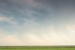 Green grass, cloudy sky