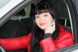 woman is calling by mobile phone in a car