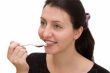 woman eats yoghurt