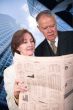 business partners reading financial paper