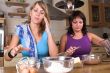 Two girl baking in the kitchen