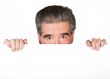 senior business man peeping over