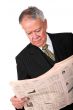 business manager reading newspaper
