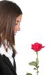 business girl admiring rose