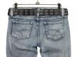 Blue jeans with leather belt