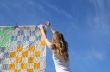 Longhaired girl and bright laundry
