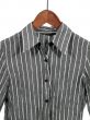 Gray striped shirt on wooden hanger