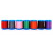 Row of colorful thread spools