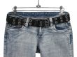 Blue jeans with black leather belt
