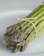 Asparagus on a white plate.