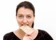 woman eats bread