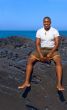 On rock by sea