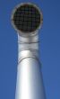 Shiny metallic ventilation pipe with wire mesh
