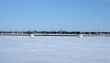 Ice fishing huts on a frozen river
