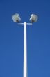 Stadium spotlights and the blue sky