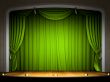 Empty stage with green curtain in expectation of perfomance