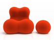 Red armchair and padded stool isolated on white background