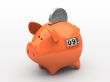 Orange piggy bank - counter on white background