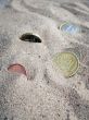 Five Coins In Sand