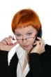 Businesswoman working, holding a cellphone and glasses