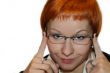 Businesswoman smiling, holding a glasses