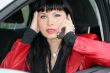 woman is calling by mobile phone in a car
