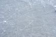 Skate marks on the surface of an outdoor ice rink