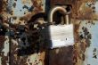 Iron lock and rusty chain