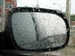 Car rear mirror with raindrops