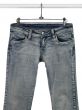 Blue jeans on a closet rod
