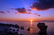 Sunset over rocky beach