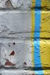 Graffiti detail on a peeling painted wall