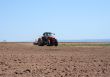 Tractor plowing land