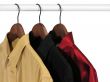 Colorful shirts on hangers, on white background