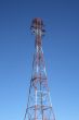 Top of the red and white electricity pylon