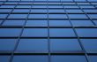 Blue glass panels of a skyscraper