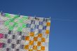 Patchwork counterpane on a clothes-line