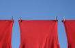 Red t-shirts on a clothes-line