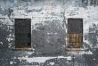 Grungy wall with two windows