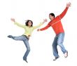 happy casual couple jumping up